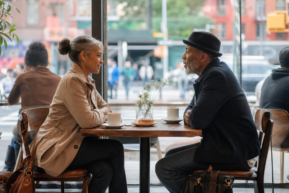 Two New Yorkers over 50 meeting for a comfortable first date in a public cafe